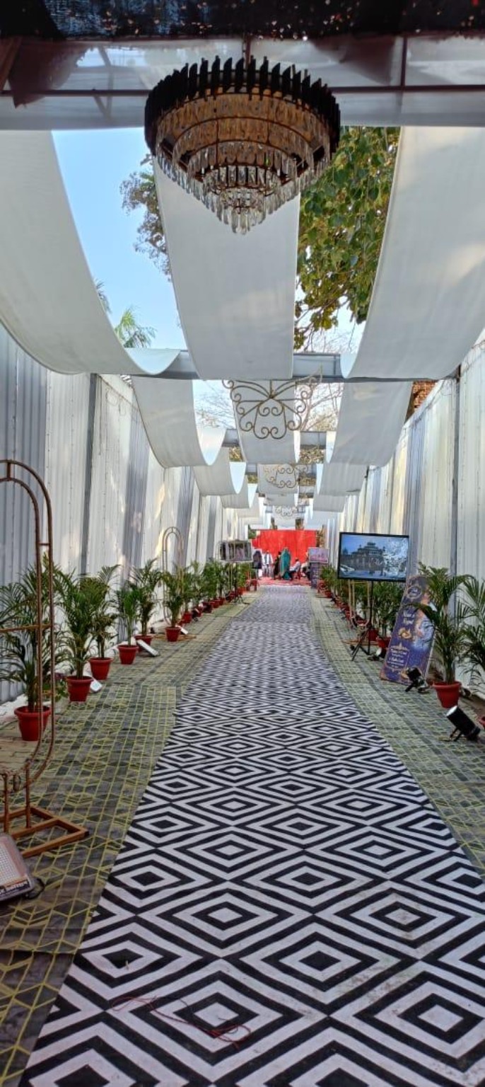 Outdoor white canopy and chandelier décor